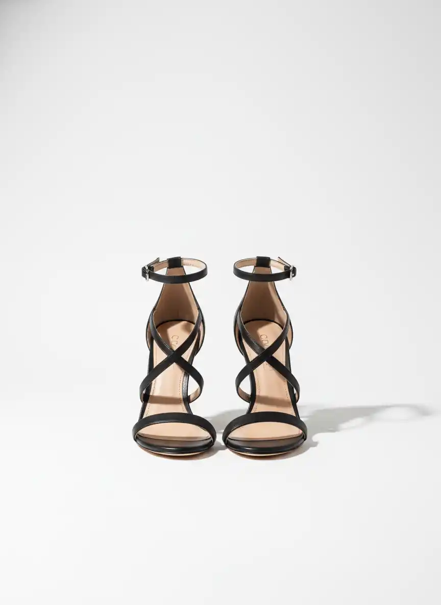 A luxury fashion logo featuring a stylized leg silhouette in high heels, evoking elegance and modern glamour.